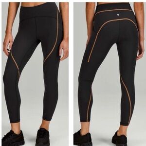 Lululemon Athletica Black Leggings with Tan stitch. Power Thru high rise